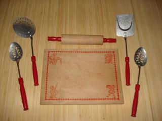 spoons a rolling pin and a wooden cutting board the board measures