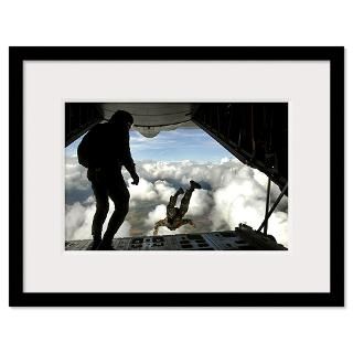 Pararescuemen jump out the back of a C130 Hercules Framed Print