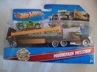 NEW HOT WHEELS MOUNTAIN MISSION TRANSPORTER W/ 1 HOT WHEELS VEHICLE
