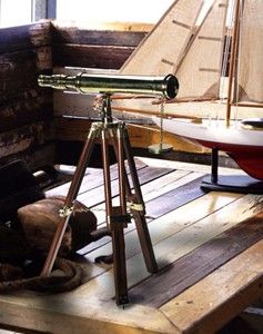 The desktop refractor telescope is hand crafted of solid brass and has
